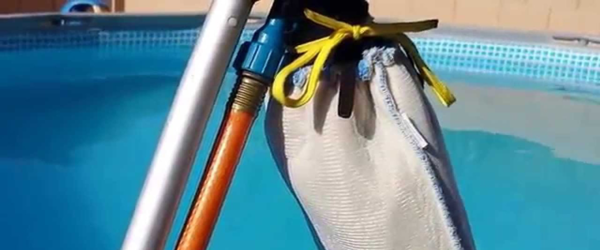 Vacuuming Debris from the Bottom of a Pool