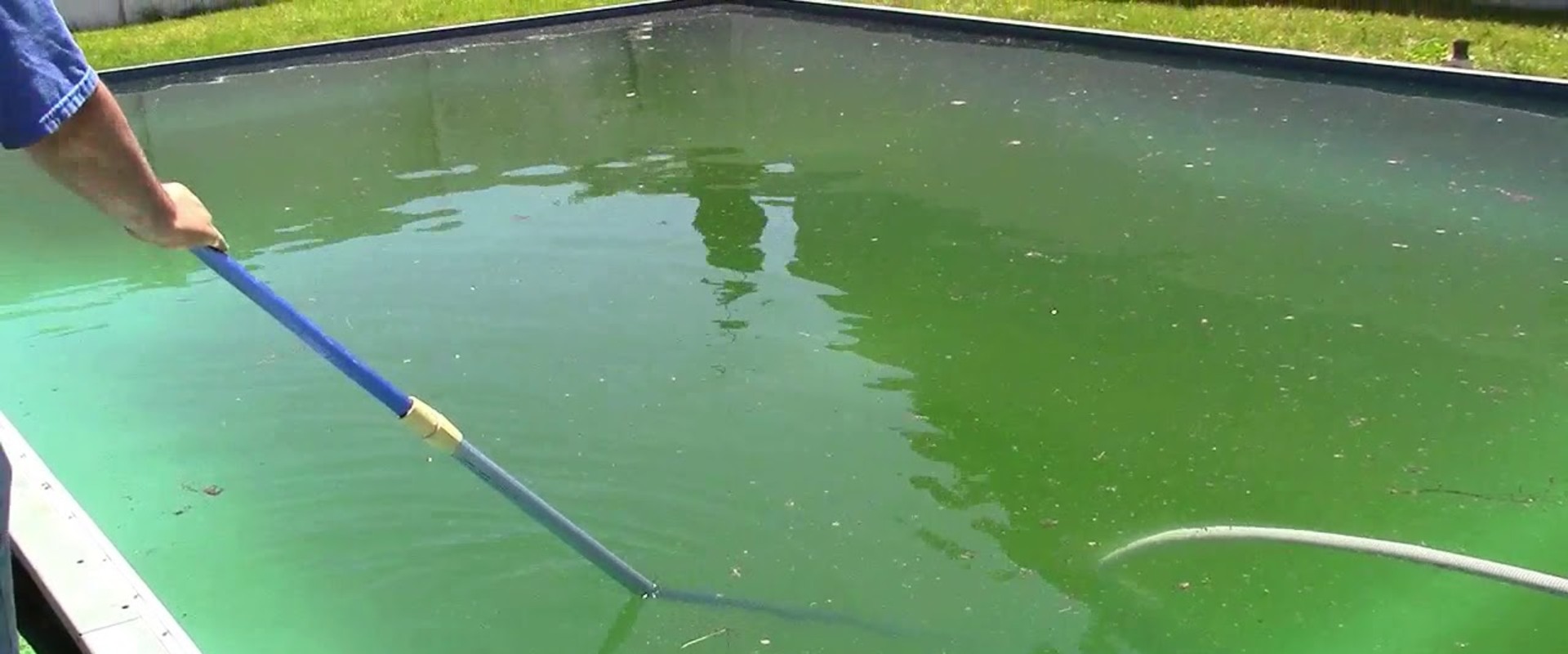 Vacuuming Debris from the Bottom of the Pool Before Opening