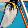 Vacuuming Debris from the Bottom of a Pool